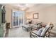 Comfortable living room features plush seating, shuttered windows, and a ceiling fan at 145 Pier View St # 111, Charleston, SC 29492