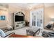 Open living room with large TV, comfortable seating, and beautiful light at 145 Pier View St # 111, Charleston, SC 29492