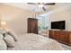 Comfortable main bedroom with armoire and large dresser near the windows at 145 Pier View St # 111, Charleston, SC 29492