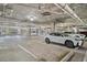 Bright parking garage for residents' convenience, featuring cars parked neatly in designated spots at 145 Pier View St # 111, Charleston, SC 29492