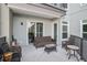 Cozy condo patio with wicker furniture, ideal for relaxation and enjoying outdoor living at 145 Pier View St # 111, Charleston, SC 29492
