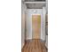 Hallway with hardwood floors and modern lighting, highlighting the clean and stylish design at 150 Bee St # 308, Charleston, SC 29401