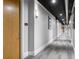 Hallway view shows a long hallway with room numbers along a carpeted floor at 150 Bee St # 308, Charleston, SC 29401