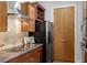 Kitchen featuring wooden cabinets, stainless steel appliances and a stylish tile backsplash at 150 Bee St # 308, Charleston, SC 29401