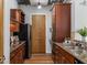 Well-equipped kitchen with stainless steel appliances, granite countertops, and wooden cabinets at 150 Bee St # 308, Charleston, SC 29401