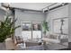 Bright living room with modern design, exposed ductwork, and an outdoor patio view through large glass sliding doors at 150 Bee St # 308, Charleston, SC 29401