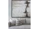 Comfortable living room showcases a sofa with decorative pillows and a large painting at 150 Bee St # 308, Charleston, SC 29401