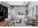 Modern living room with a seating area and balcony access, perfect for relaxing or entertaining guests at 150 Bee St # 308, Charleston, SC 29401