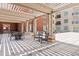 Spacious outdoor patio with a pergola, beautiful columns, and stylish pavers, perfect for relaxing and enjoying the weather at 150 Bee St # 308, Charleston, SC 29401