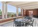 This outdoor patio features an overhead structure with seating and a view of the surrounding landscape at 150 Bee St # 308, Charleston, SC 29401
