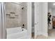 This bathroom features a shower and tub with gray tile, with built in shelving at 1541 Homecoming Blvd, Ravenel, SC 29470