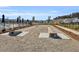 Outdoor games area featuring cornhole with manicured surroundings and community houses nearby at 1541 Homecoming Blvd, Ravenel, SC 29470