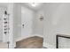 Bright entryway with a white front door, wooden floors and a 'Welcome' sign creating a cozy atmosphere at 1541 Homecoming Blvd, Ravenel, SC 29470