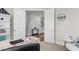 Bright office with a view of the staircase, decorated with a clock, and a door that opens to another room at 1541 Homecoming Blvd, Ravenel, SC 29470