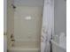 Bathroom with a combination shower and tub with white shower curtain with seahorse design at 1551 Ben Sawyer Blvd # 4D, Mount Pleasant, SC 29464
