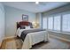 Bedroom with a queen bed, hardwood floors, plantation shutters and neutral colored walls at 1551 Ben Sawyer Blvd # 4D, Mount Pleasant, SC 29464