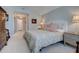 Bedroom featuring neutral walls, a decorative bed, bedside tables, and stylish decor at 1551 Ben Sawyer Blvd # 4D, Mount Pleasant, SC 29464