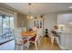 Charming dining area with wood table, elegant chandelier, and access to outdoor patio at 1551 Ben Sawyer Blvd # 4D, Mount Pleasant, SC 29464