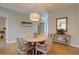 Dining area with a round table, stylish lighting, and light wood floors at 1551 Ben Sawyer Blvd # 4D, Mount Pleasant, SC 29464