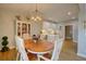 Dining area adjacent to the kitchen features stylish chandelier and seating for six at 1551 Ben Sawyer Blvd # 4D, Mount Pleasant, SC 29464