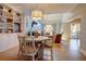 Bright dining room with custom shelving and a view of the inviting living room at 1551 Ben Sawyer Blvd # 4D, Mount Pleasant, SC 29464