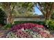 The entrance to Simmons Pointe is beautifully landscaped with vibrant flowers and mature trees at 1551 Ben Sawyer Blvd # 4D, Mount Pleasant, SC 29464
