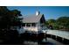 An aerial shot of a structure elevated above the water, surrounded by lush trees and foliage at 1551 Ben Sawyer Blvd # 4D, Mount Pleasant, SC 29464