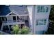 Aerial view of this lovely three-story townhome with an open deck and American flag at 1551 Ben Sawyer Blvd # 4D, Mount Pleasant, SC 29464