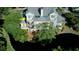 Beautiful home featuring balconies and complemented by lush trees along a waterway at 1551 Ben Sawyer Blvd # 4D, Mount Pleasant, SC 29464