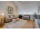 Spacious living room boasting high ceilings, comfortable sofas, stylish decor, and natural light from skylight windows at 1551 Ben Sawyer Blvd # 4D, Mount Pleasant, SC 29464