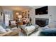 Cozy living room featuring stylish furniture, a fireplace, and built-in shelving for decor at 1551 Ben Sawyer Blvd # 4D, Mount Pleasant, SC 29464