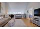 Bright living room with a comfortable seating area, stylish decor, and access to other areas of the home at 1551 Ben Sawyer Blvd # 4D, Mount Pleasant, SC 29464