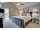 Main bedroom with a king size bed, carpet and a ceiling fan with overhead lighting at 1551 Ben Sawyer Blvd # 4D, Mount Pleasant, SC 29464