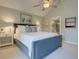 Main bedroom with king size bed, neutral colored walls and carpet and view to a bathroom at 1551 Ben Sawyer Blvd # 4D, Mount Pleasant, SC 29464