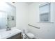 Clean bathroom featuring a modern sink vanity, toilet, and grab bar, offering accessibility and style at 1607 Roustabout Way, Charleston, SC 29414