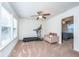 Bonus room featuring a treadmill, chair, ceiling fan, and adjacent room with carpet at 1607 Roustabout Way, Charleston, SC 29414