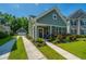 Charming home with a well-manicured lawn, colorful flowerbeds, and a convenient detached garage at 1607 Roustabout Way, Charleston, SC 29414