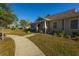 Inviting exterior view of the community clubhouse with manicured landscaping and accessible pathway at 1607 Roustabout Way, Charleston, SC 29414