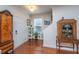 Elegant foyer featuring hardwood floors, a staircase, and decorative antique cabinets at 1607 Roustabout Way, Charleston, SC 29414