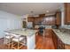Stylish kitchen with granite countertops, stainless steel appliances, custom cabinets, and center island with barstools at 1607 Roustabout Way, Charleston, SC 29414