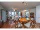 Open floor plan showing a living room, dining area, and entrance foyer, all with hardwood floors at 1607 Roustabout Way, Charleston, SC 29414