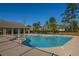Sparkling community pool with a clubhouse, surrounded by a deck and lush trees, ideal for leisure and recreation at 1607 Roustabout Way, Charleston, SC 29414