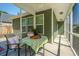 Inviting screened porch with comfortable seating and a table, offering a relaxing outdoor space at 1607 Roustabout Way, Charleston, SC 29414