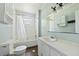 Bathroom with a shower-tub combo, single sink vanity, and blue-green walls at 1736 Central Ave, Summerville, SC 29483