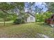 Quaint single-story house featuring a cozy front porch and surrounded by lush greenery creating a tranquil setting at 1736 Central Ave, Summerville, SC 29483