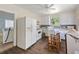 Spacious kitchen with white appliances, tile backsplash, and wood flooring at 1736 Central Ave, Summerville, SC 29483