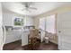 Bright kitchen featuring white cabinetry, wood floors, and a window offering natural light at 1736 Central Ave, Summerville, SC 29483