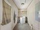 Functional laundry room featuring a washing machine, shelving, and a window at 1736 Central Ave, Summerville, SC 29483