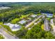 Areal view of the community amenities, pool, green spaces, and surrounding neighborhood and lush woods at 1844 Hubbell Dr, Mount Pleasant, SC 29466