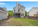 The backyard features a neatly maintained lawn with a screened-in porch and fence in view at 1844 Hubbell Dr, Mount Pleasant, SC 29466
